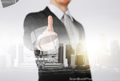 Image of businessman showing thumbs up