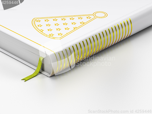 Image of Holiday concept: closed book, Party Hat on white background