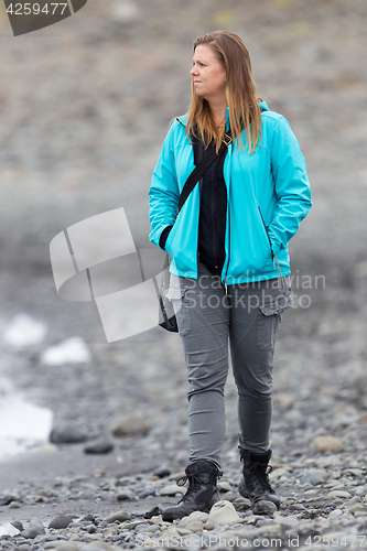 Image of Woman walking over the beach at Jokulsarlon glacier lagoon - Ice