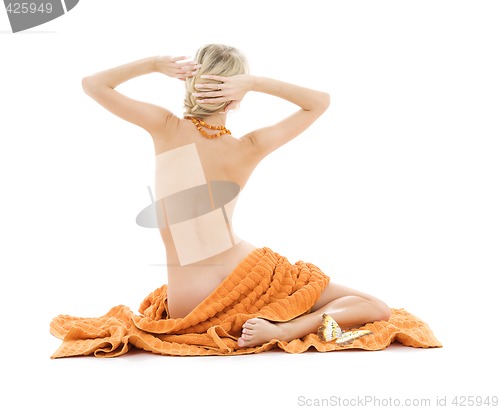 Image of beautiful lady with orange towels