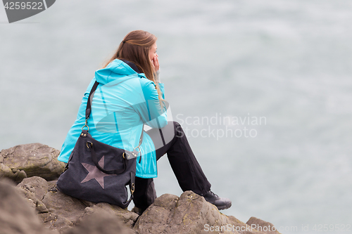 Image of Young woman enjoying the Icelandic landscape