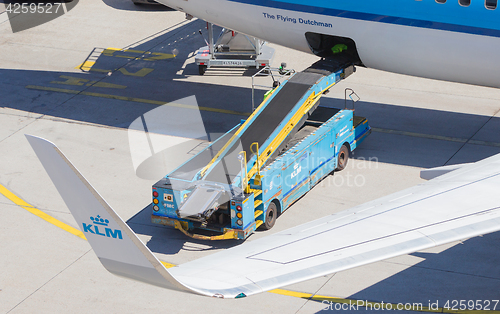 Image of AMSTERDAM, NETHERLANDS - AUGUST 17, 2016: Loading luggage in air