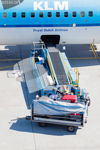 Image of AMSTERDAM, NETHERLANDS - AUGUST 17, 2016: Loading luggage in air