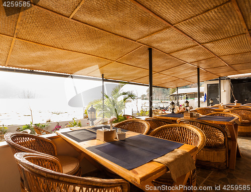 Image of Tables at a cafe next to lake