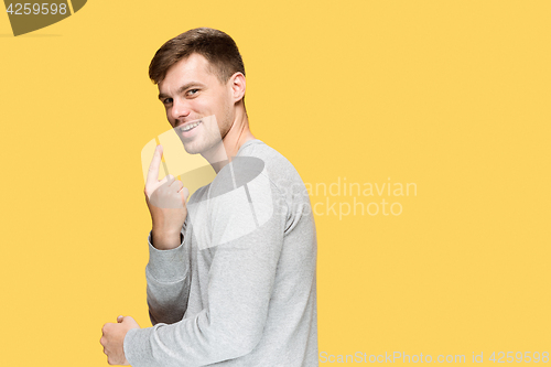 Image of The young man smiling and looking at camera