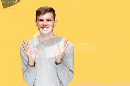 Image of The young man smiling and looking at camera