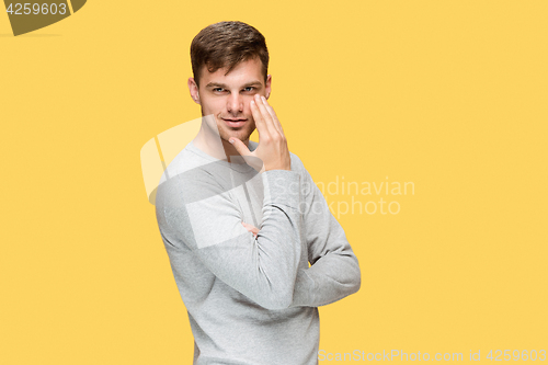 Image of The young man smiling and looking at camera