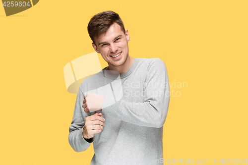 Image of The young man smiling and looking at camera