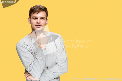 Image of The young man smiling and looking at camera