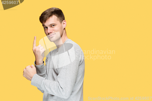 Image of The young man smiling and looking at camera