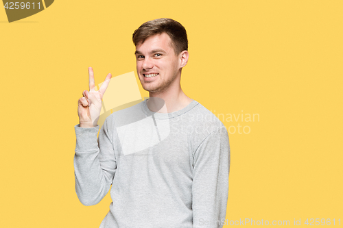 Image of The young man smiling and looking at camera