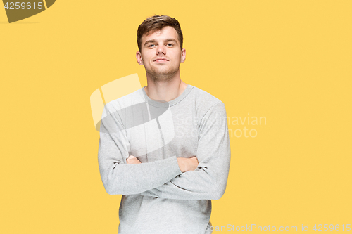 Image of The young man smiling and looking at camera