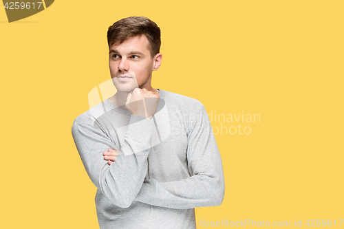 Image of The young man smiling and looking away