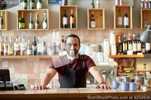 Image of happy man, barman or waiter at bar