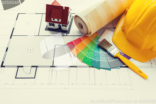 Image of close up of house blueprint with building tools