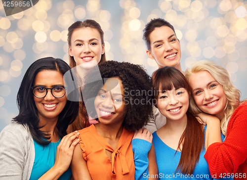 Image of international group of happy women hugging