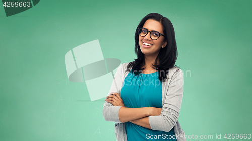 Image of happy smiling young indian woman in glasses