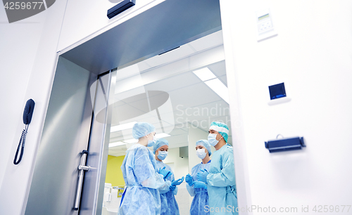 Image of group of surgeons in operating room at hospital