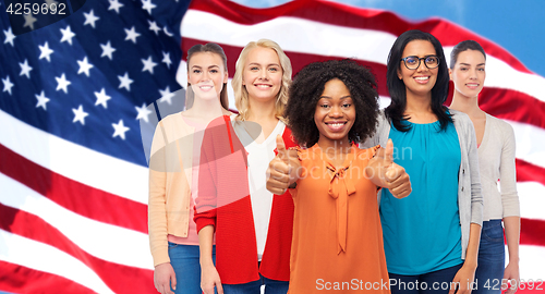 Image of international american women showing thumbs up