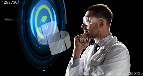 Image of scientist in goggles looking at virtual projection