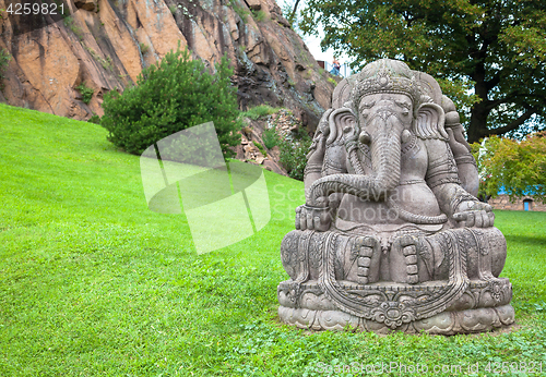 Image of Ganesha statue in a beautiful mountain garden