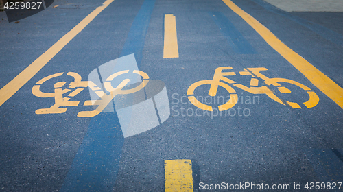 Image of Bicycle signs painted on asphalt