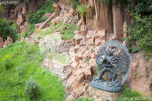 Image of Tantric Deities statue in Ritual Embrace located in a mountain g