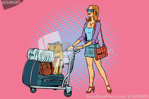 Image of Woman tourist with Luggage cart