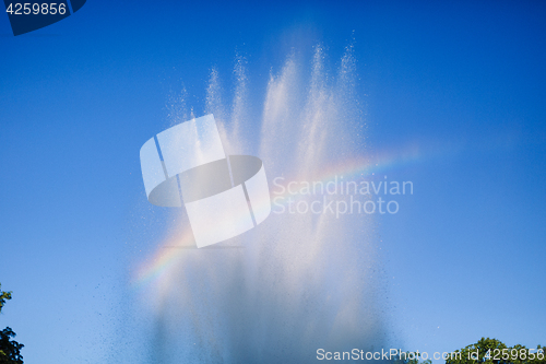 Image of Splashes of water on blue sky