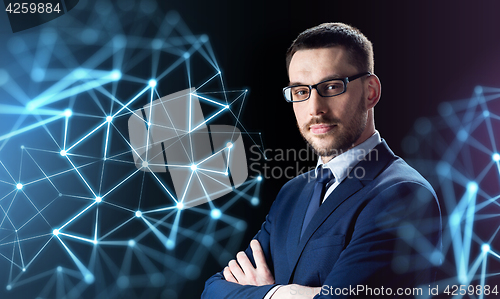 Image of businessman in glasses over black