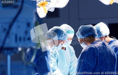 Image of group of surgeons in operating room at hospital