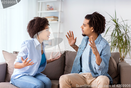 Image of unhappy couple having argument at home