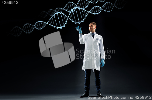 Image of scientist in lab coat and medical gloves with dna