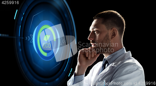 Image of scientist looking at virtual projection