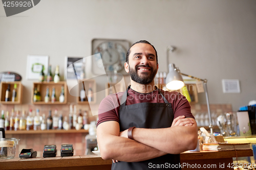 Image of happy man, barman or waiter at bar