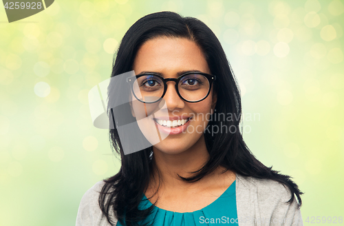 Image of happy smiling young indian woman in glasses