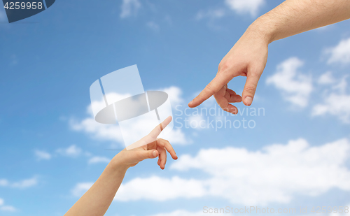 Image of father and child hands pointing fingers