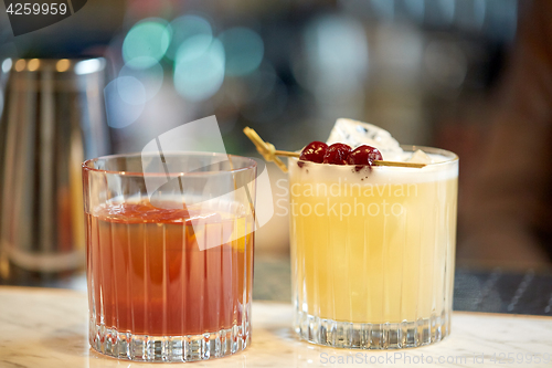 Image of glasses of cocktails at bar