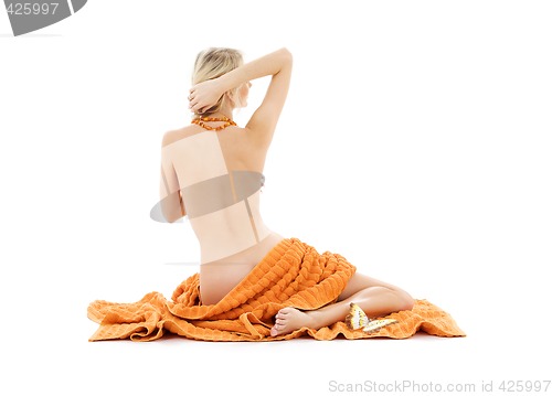 Image of beautiful lady with orange towels