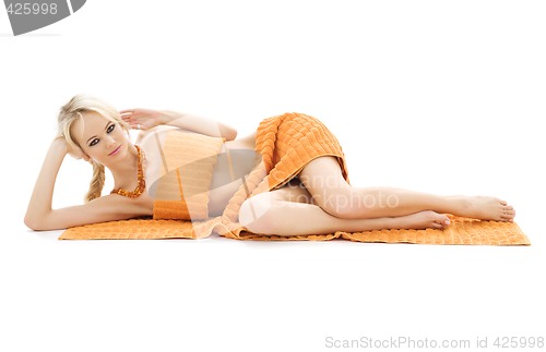 Image of beautiful lady with orange towels