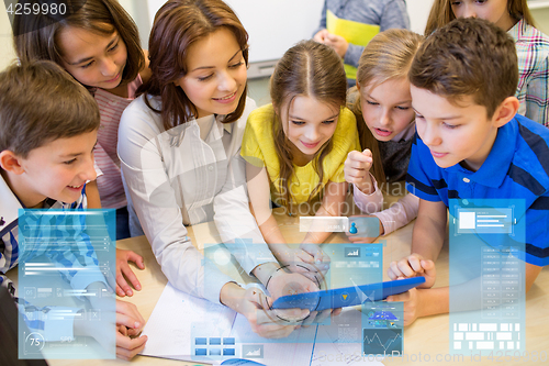 Image of group of kids with teacher and tablet pc at school