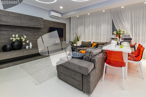 Image of Modern white living room with dining table