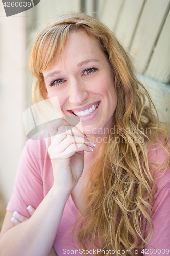 Image of Outdoor Portrait of Young Adult Brown Eyed Woman.