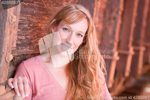 Image of Outdoor Portrait of Young Adult Brown Eyed Woman.