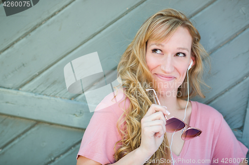 Image of Outdoor Portrait of Young Adult Brown Eyed Woman With Sunglasses