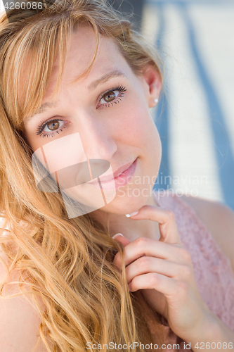 Image of Outdoor Portrait of Young Adult Brown Eyed Woman.