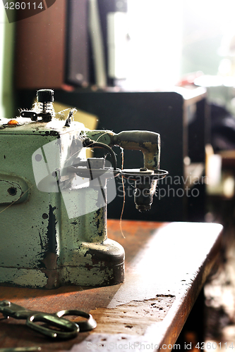 Image of Sewing machine in a tailor shop. 