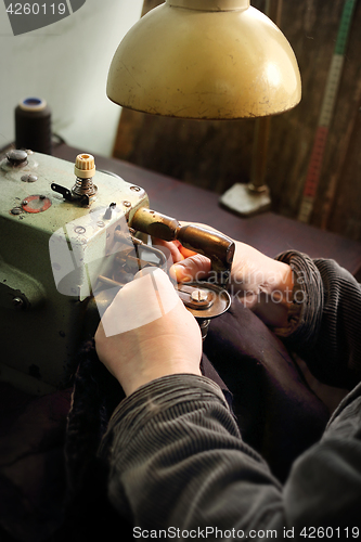 Image of Fur sewing. Furrier. Workshop of fur.