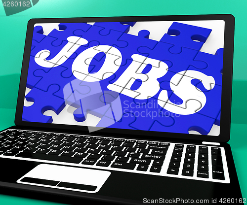 Image of Jobs Puzzle On Notebook Shows Online Applications