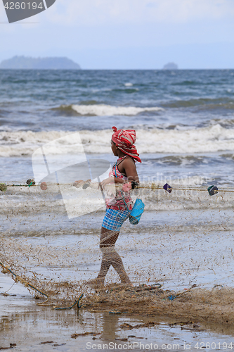 Image of Native Malagasy fishermen fishing on sea, Madagascar